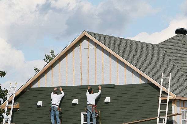 Professional Siding technician working in Harmans, MD